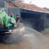 Hujan, Penyemprotan Disinfektan Tetap Jalan